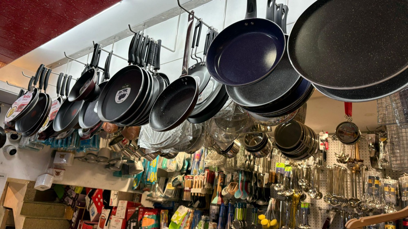 Non-stick pans hanging from the ceiling